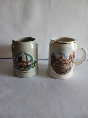 Lot of 2 German Landmark Beer Steins, 1 Gray Stoneware & 1 Porcelain Disney